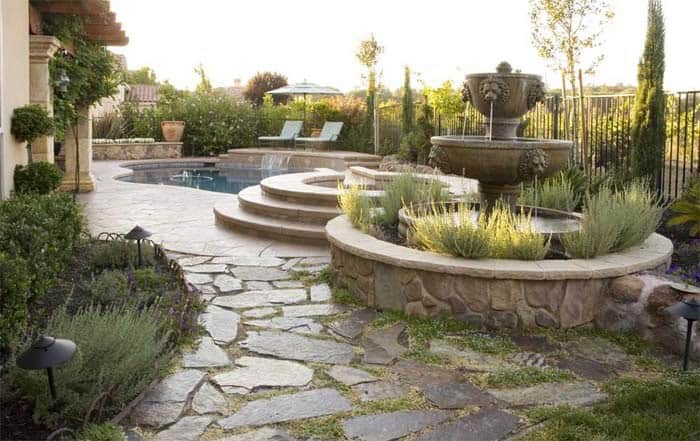 Lion’s Head Fountain Surrounded by Raised Garden