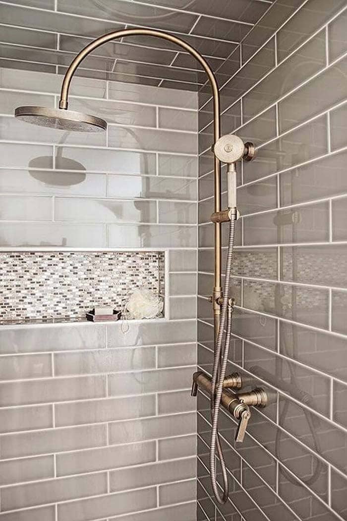 Matching Tile In Varied Sizes Adds Interest To A Shower Niche