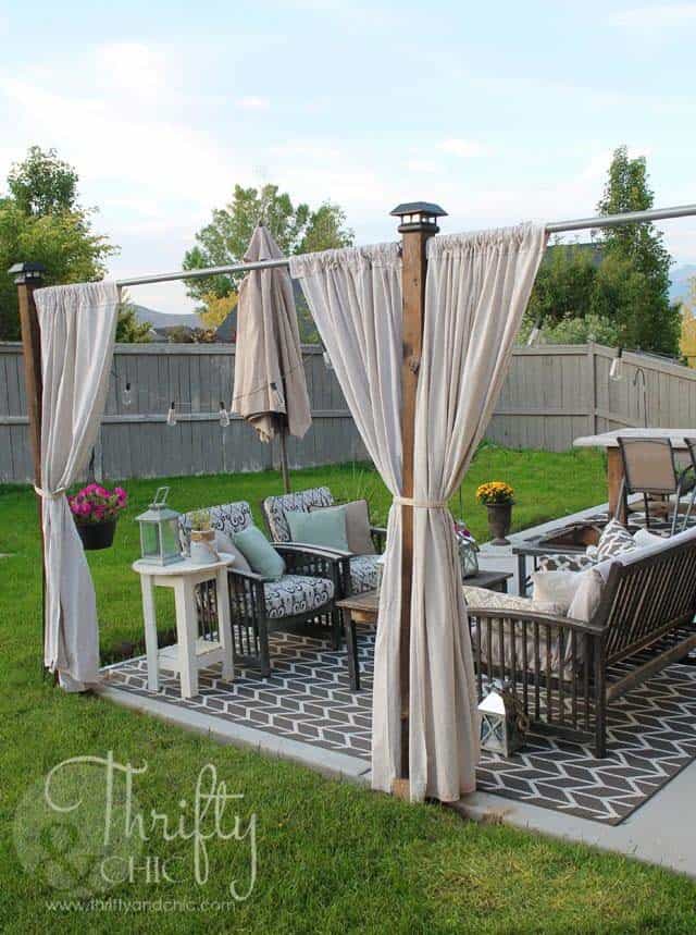 Increase Privacy on Your Patio with Wooden Posts and Curtains