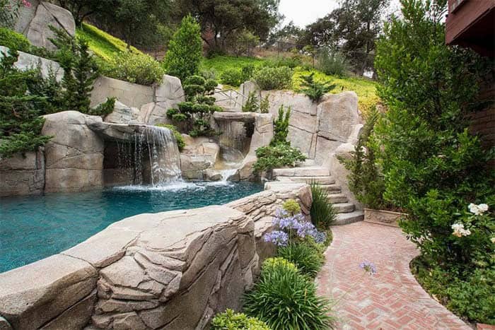 Create a Lavish Oasis with a Rocky Hillside Pool