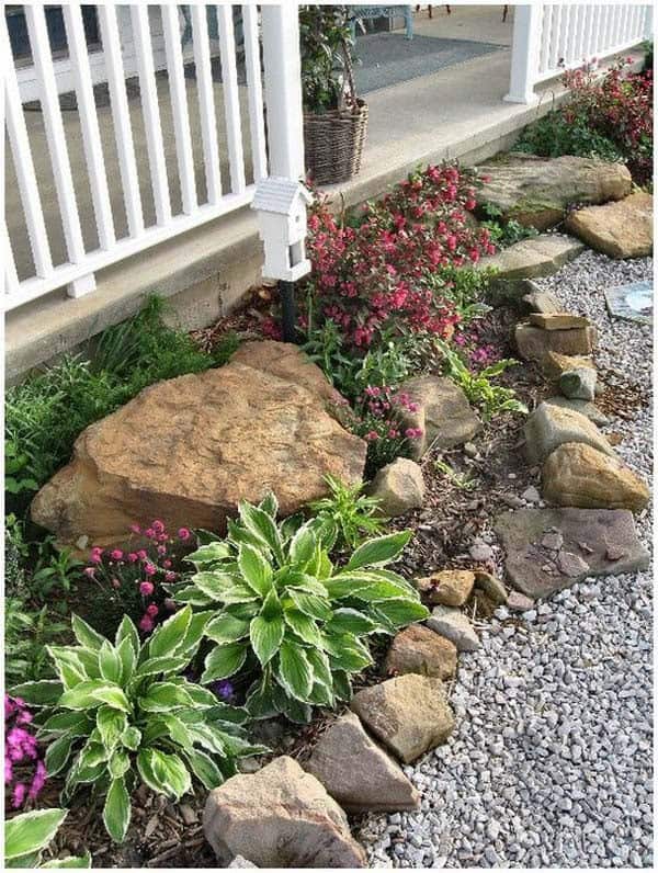 Surround Boulders with Flowers for a Rustic Porch Look