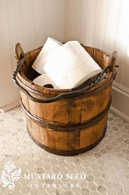 Store Toilet Paper in a Vintage Bucket for Decorative Appeal