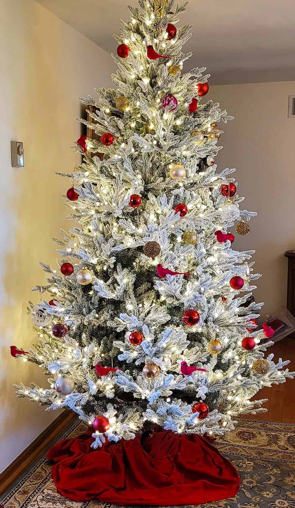 Flocked Christmas Tree With Red Ornaments