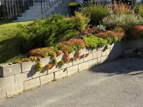 Reclaim Uphill Stability with a Cinder Block Retaining Wall